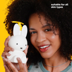 Miffy Sweet Wonder Body Lotion — model holding the Miffy body lotion bottle