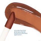Miffy Tinted Lip Oil — Cocoa Cutie — slim doe-foot applicator beside a brown lip oil swatch
