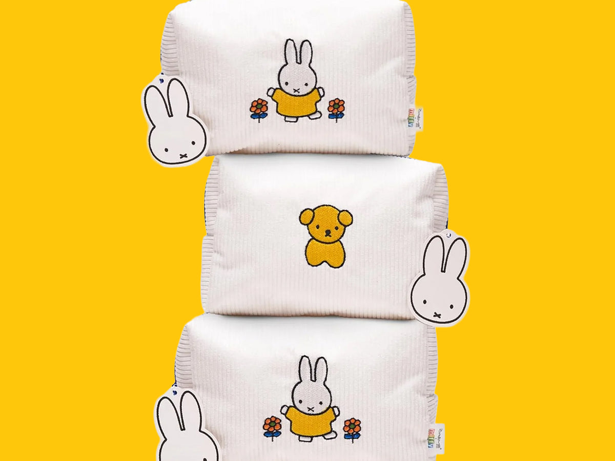 Miffy Perfect Travel Makeup Bags with bunny and bear designs on a yellow background.