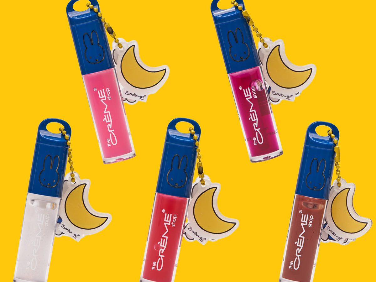 Miffy Tinted Lip Oil shades with blue caps and moon charms on a yellow background.