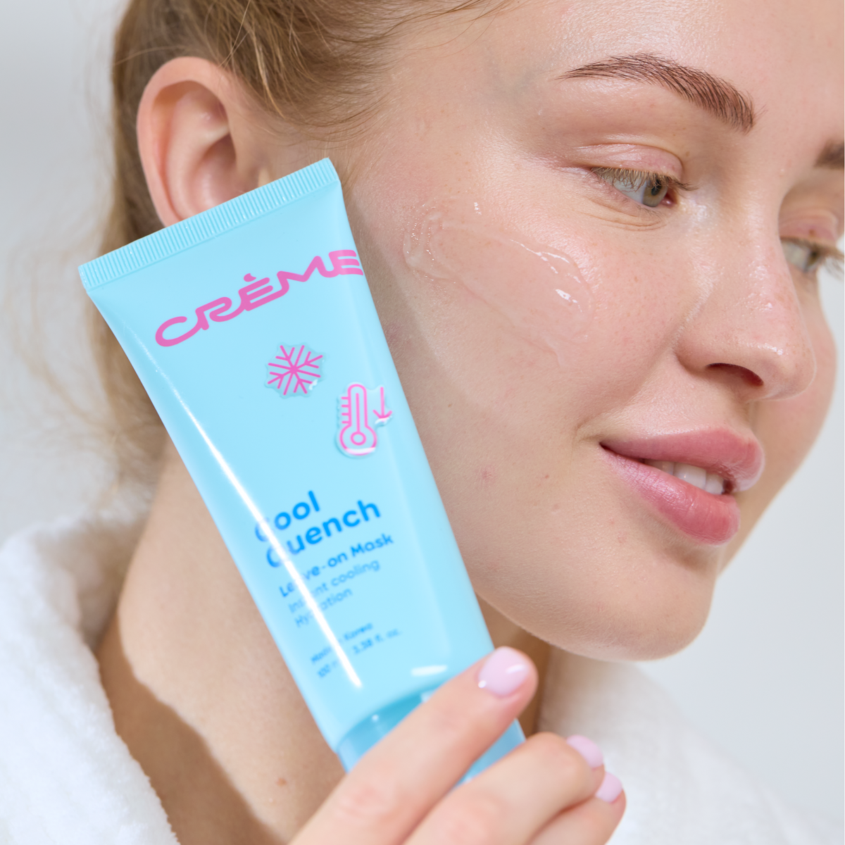 Cool Quench Leave On Mask — model holding the tube beside her cheek