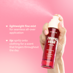 Tropic Lush Body Mist — hand spraying the body mist with application tips
