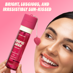 Tropic Lush Body Mist — model holding the bottle beside her face