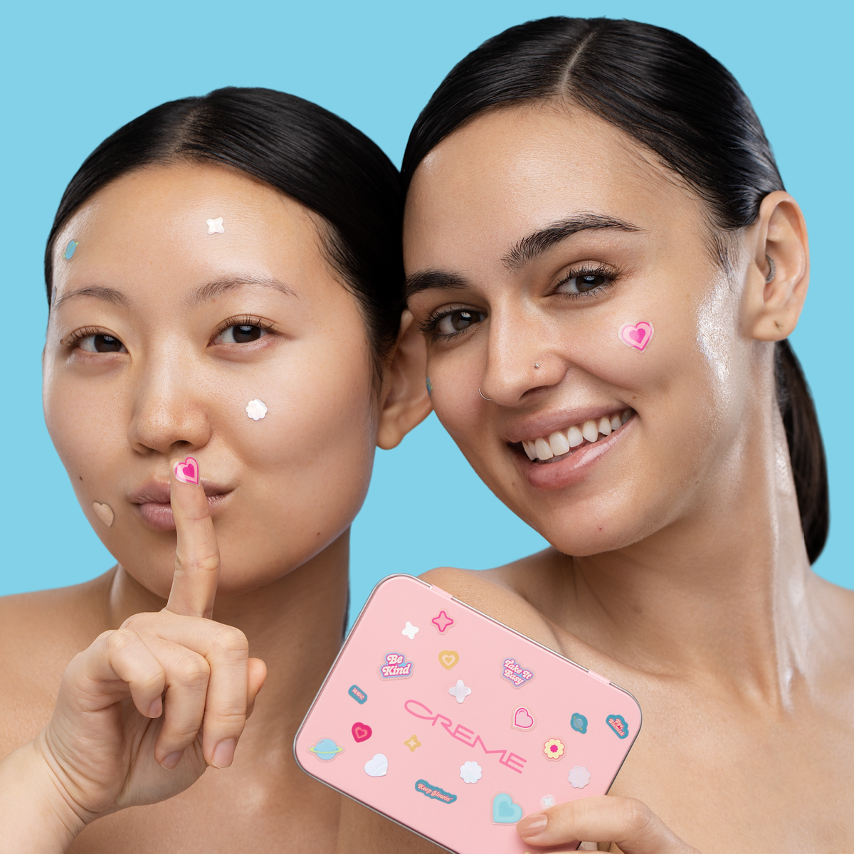 Totally Clear Blemish Patches — two models wearing colorful blemish patches and holding the tin