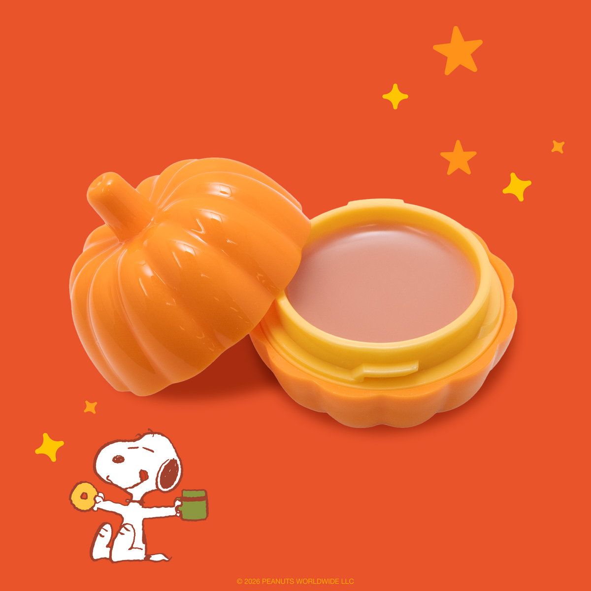 Peanuts Great Pumpkin Overnight Lip Masque — open pumpkin jar showing pink lip masque beside Snoopy artwork